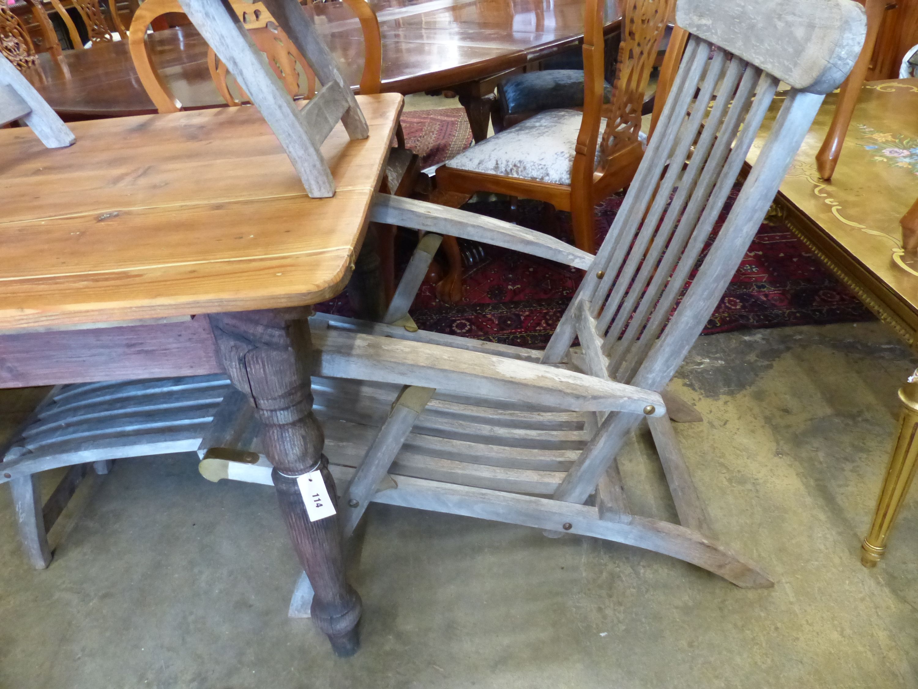 A pair of weathered teak garden steamer chairs, width 59cm, depth 150cm, height 98cm